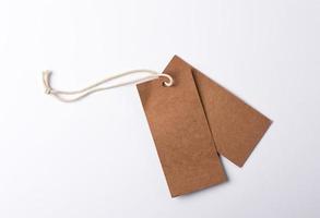 empty paper brown tag on the rope, white background photo