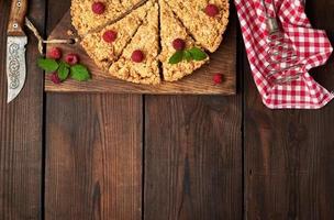 sliced triangular pieces of crumble pie with apples photo