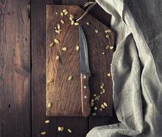very old empty brown wooden cutting board photo