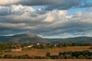 Thick clouds over a green valley with mountains Baydarskaya photo