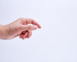 female hand showing gesture of holding an object photo