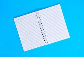 notebook with empty white sheets in line photo