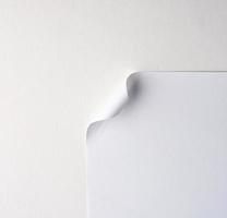 blank white sheet of paper with a curved corner photo