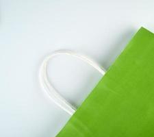 empty green paper shopping bag with a handle photo