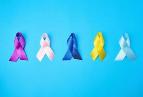 blue, purple, yellow, blue, pink ribbon in the form of a bow photo