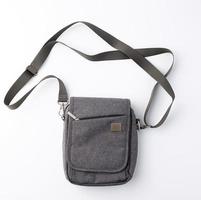 gray textile men's bag with a long strap on a white background photo