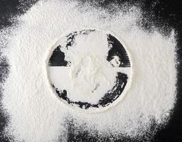 sprinkled white flour, round imprint from sieve photo