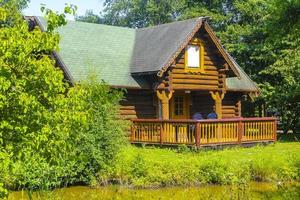 Brown vacation cottage house made of wood in nature Germany. photo