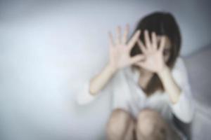 blurred photo Women use cloth to hide their bodies in fear.  Stop sexual harassment and rape. International Women's Day.