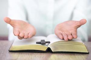 Hands praying on a Holy Bible, spirtuality and religion, Religious concepts photo