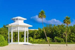 White noble pergula pavilion in paradise on beach palms Mexico. photo