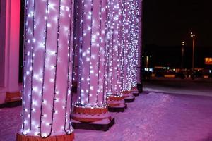 Festive illumination on the boulevard at night photo