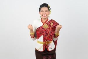 Young beautiful woman in Thai lanna costume with gladful posture photo