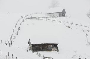 An abundant snowfall in the Romanian Carpathians in the village of Sirnea, Brasov. Real winter with snow in the country photo