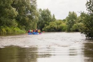 competition of teams on catamarans on the river, rafting photo