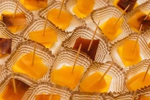 Canapes of cheese with fruits and marmalade, close-up shot photo