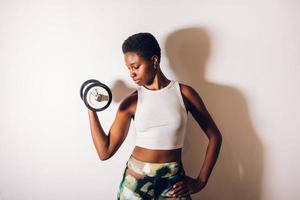 black woman with a dumbbell photo