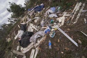 Close up illegally dumping garbage in park concept photo