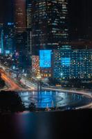 Night cityscape,and traffic light of highway in slow speed shutter motion effect and noise.Jakarta, Indonesia .January 9 2023 photo