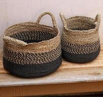 antique ethnic woven basket on wooden table photo