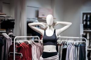 Two mannequins standing in a women's casual clothing store photo