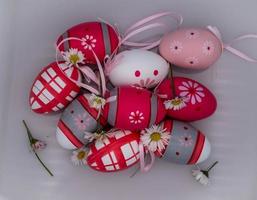 beautiful colored Easter eggs with daisies on a transparent white background photo