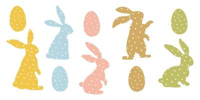 A set of Easter bunnies made of polka dot fabric sewn. Modern egg, rabbits for children. Rabbit or hare, a spring festive animal with Easter eggs. Cartoon festive simple vector character.