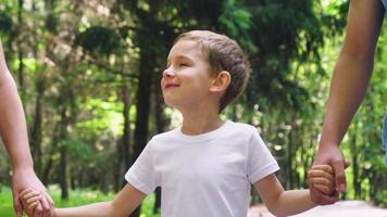 A family of three is walking in the park video