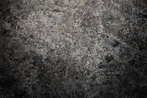 Gray textured cement wall background with fine concrete chips. Construction backgrounds photo