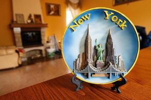 New York souvenir plate on a stand at home. photo