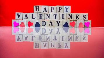 Happy valentine day on wooden blocks photo