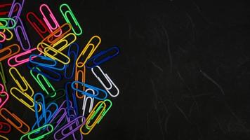 Paper clip isolated on a black background photo