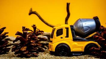 Minahasa, Indonesia  saturday, December 2022, a toy car among the pinecones photo