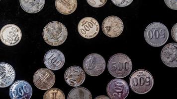 pile of rupiah coins as background photo