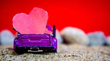 Minahasa, Indonesia December 2022, the toy cars transporting hearts photo