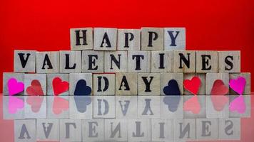 Happy valentine day on wooden blocks photo