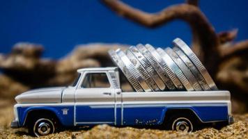 minahasa, Indonesia  January 2023, Toy car carrying coins photo