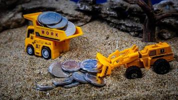 minahasa, Indonesia  January 2023, toy trucks transport coins photo