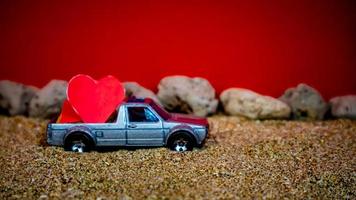 Minahasa, Indonesia  December 2022, the toy cars transporting hearts photo