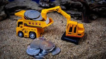 minahasa, Indonesia  January 2023, toy trucks transport coins photo