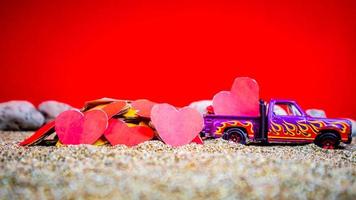 Minahasa, Indonesia  December 2022, the toy cars transporting hearts photo