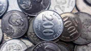 pile of rupiah coins as background photo