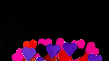 multicolored heart on black background for valentine's day photo