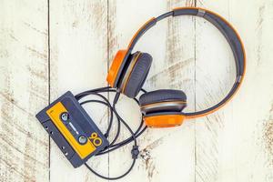 vintage audio cassettes and headphones over a black chalkboard photo