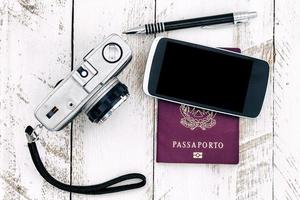 passport vintage camera and smart phone photo