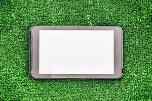 smartphone with clean screen on a grass background photo