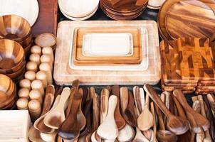 Wooden kitchen utensils at street market in thailand photo