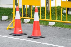 traffic warning cone in row to separate route in parking area ,View of a Vehicle Security Barrier photo