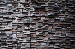 exposed wooden wall exterior, patchwork of raw wood forming a beautiful parquet wood pattern,Wood wall pattern,for background photo