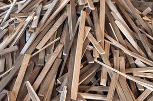 Pile of wood logs for build Furniture production,sew natural wood scraps, ready to recycle and reuse process in improved waste management under efficient sustainable approach to save environment photo
